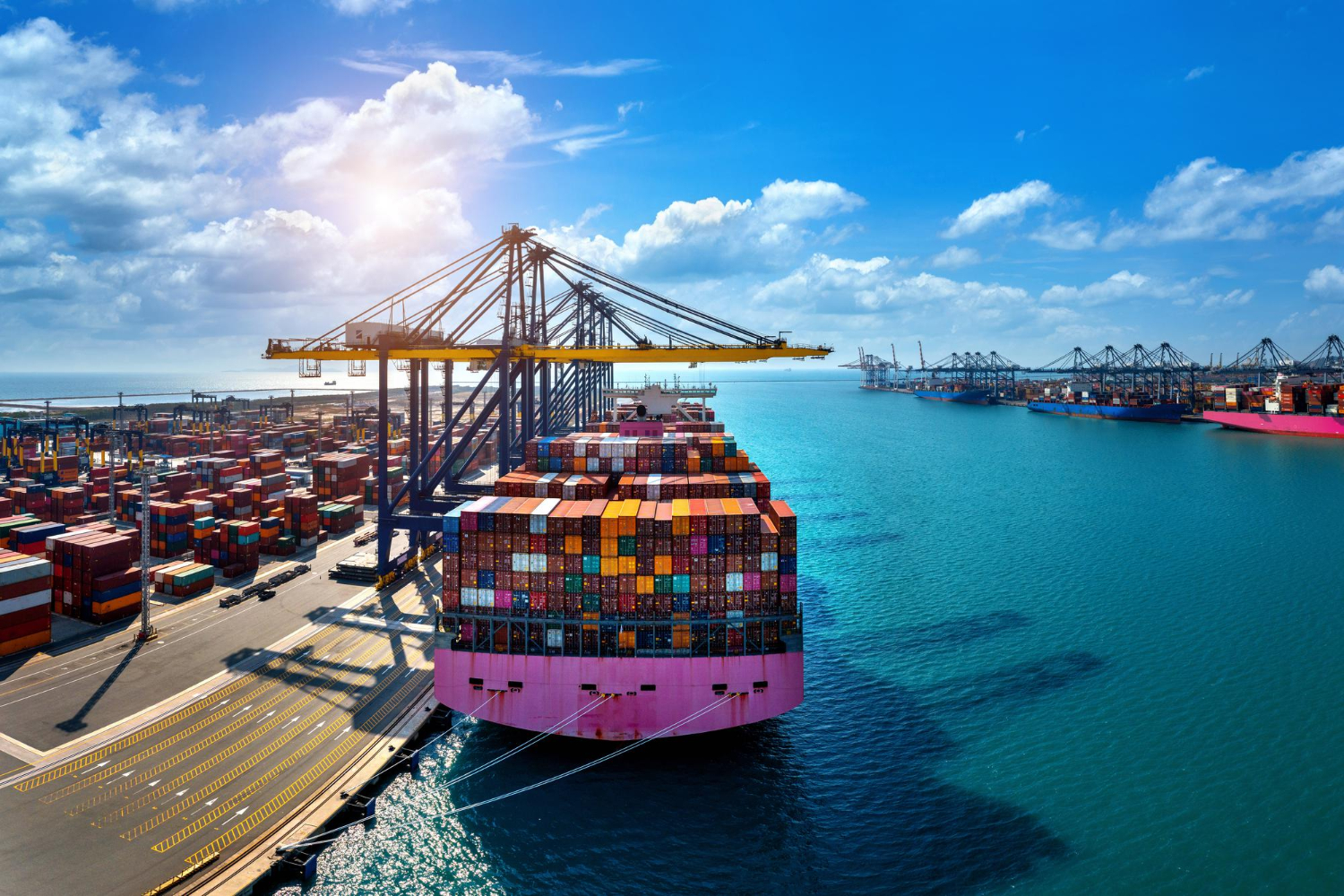Container vessel berthed at an African deep-water port at sunrise